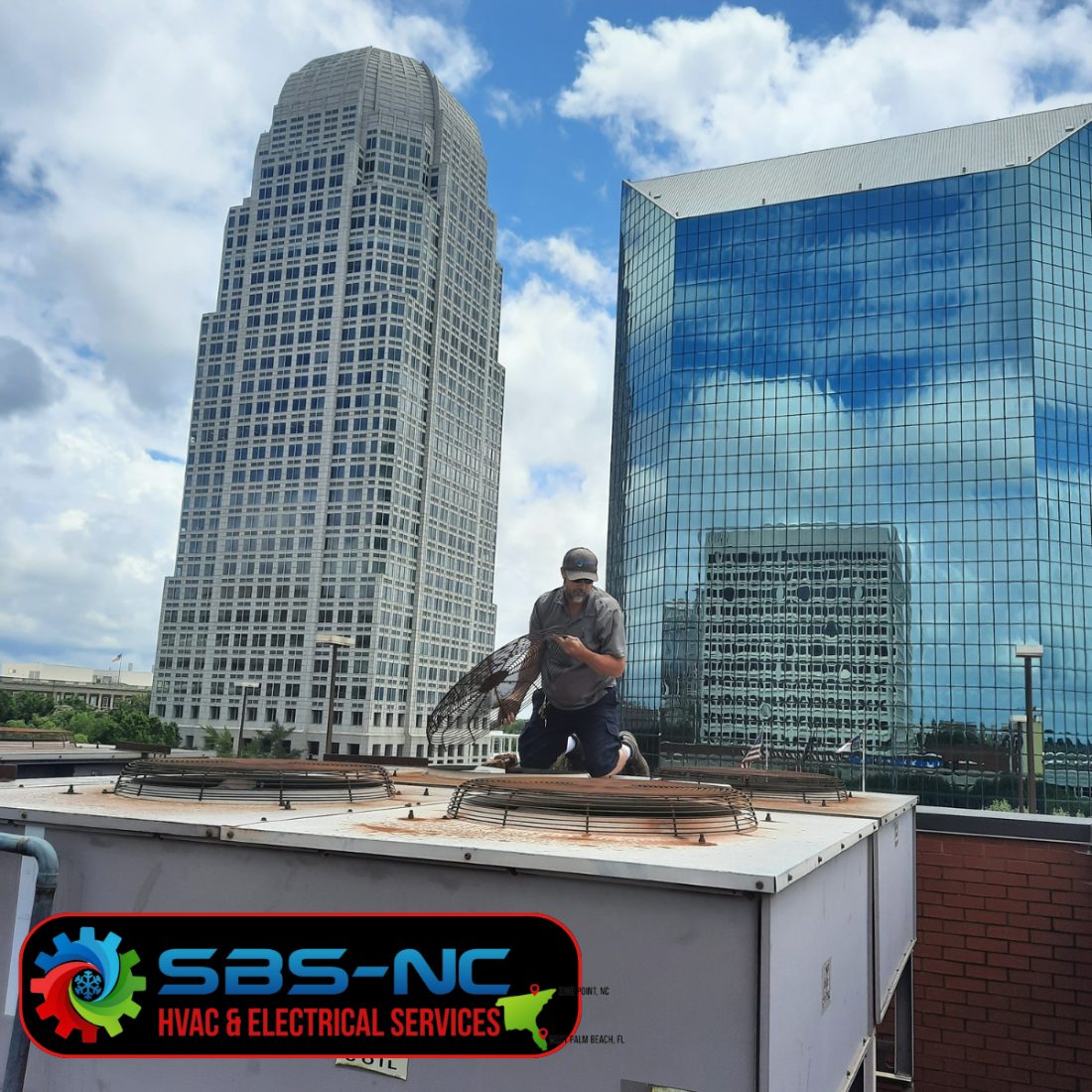 Commercial rooftop HVAC units serviced by SBS-NC technicians overlooking the city skyline